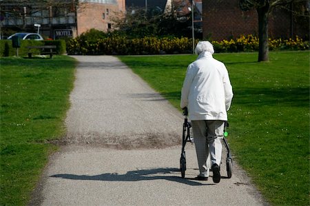 Senior woman with a walking frame. Stock Photo - Budget Royalty-Free & Subscription, Code: 400-05137407
