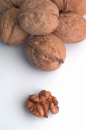 simsearch:400-04833195,k - several walnuts on white background, one nut already cracked Stock Photo - Budget Royalty-Free & Subscription, Code: 400-05130046