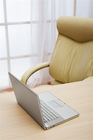 simsearch:400-06091866,k - laptop on a table of director at modern office Stock Photo - Budget Royalty-Free & Subscription, Code: 400-05132401