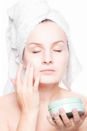 simsearch:400-04335125,k - Woman in towel applying cream Stock Photo - Budget Royalty-Free & Subscription, Code: 400-05132547