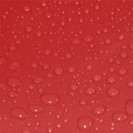 simsearch:400-05363406,k - Water drops on a clean red surface Stock Photo - Budget Royalty-Free & Subscription, Code: 400-05133192