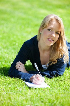 simsearch:400-04416781,k - Pretty girl studying on a green meadow during summer Stock Photo - Budget Royalty-Free & Subscription, Code: 400-05133561