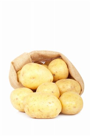 Burlap sack with raw and fresh potatoes spilling out over a white background. Soft shadow Stock Photo - Budget Royalty-Free & Subscription, Code: 400-05133907