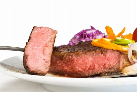 simsearch:400-06079651,k - fresh juicy beef ribeye steak sliced ,with lemon and orange peel on top  and vegetable beside Stock Photo - Budget Royalty-Free & Subscription, Code: 400-05144278