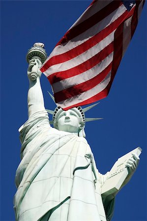 statue of liberty and flag images - statue of liberty against a clear blue sky united states of america Stock Photo - Budget Royalty-Free & Subscription, Code: 400-05146196