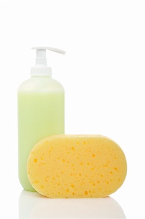 Plastic pump soap bottle and sponge reflected on white background Foto de stock - Super Valor sin royalties y Suscripción, Código: 400-05147797