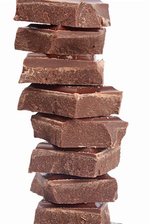 simsearch:400-05136453,k - Blocks of chocolate isolated on white background. Shallow depth of field Stock Photo - Budget Royalty-Free & Subscription, Code: 400-05140294