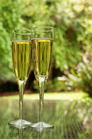 spanishalex (artist) - Two champagne glasses bathed in green light on a summer terrace Stock Photo - Budget Royalty-Free & Subscription, Code: 400-05142319