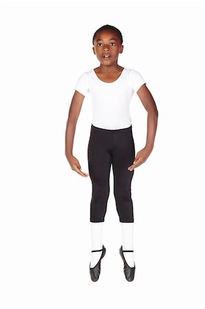 Young African ballet boy on white background and floor showing various ballet steps and positions. Not Isolated Foto de stock - Super Valor sin royalties y Suscripción, Código: 400-05154696