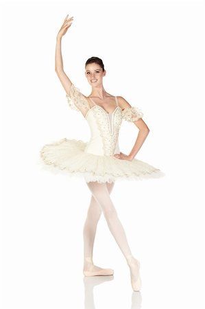 simsearch:400-04119672,k - Young caucasian brunette ballerina girl on white background and reflective white floor showing various ballet steps and positions. Not Isolated Stock Photo - Budget Royalty-Free & Subscription, Code: 400-05154698