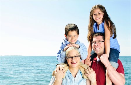 Happy family having fun giving shoulder rides Stock Photo - Budget Royalty-Free & Subscription, Code: 400-05157019