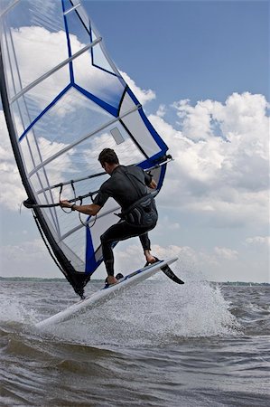 Windsurfer doing a flip trick in the water Stock Photo - Budget Royalty-Free & Subscription, Code: 400-05158658