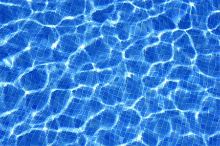 Blue water texture, tiles pool in sunny day with light reflections Stock Photo - Budget Royalty-Free & Subscription, Code: 400-05159516
