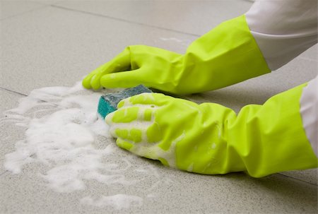 Hand in glove scrubbing tile with a sponge Stock Photo - Budget Royalty-Free & Subscription, Code: 400-05159620