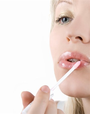 simsearch:400-04366344,k - Pretty girl paint her lips on white Stock Photo - Budget Royalty-Free & Subscription, Code: 400-05152387