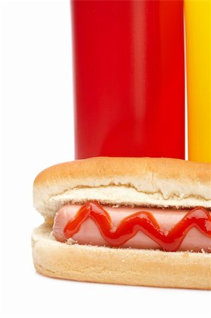 simsearch:400-04587885,k - A hot dog with ketchup and mustard bottles isolated on white background Stock Photo - Budget Royalty-Free & Subscription, Code: 400-05153775