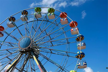 A colorful big fun wheel against blue sky Stock Photo - Budget Royalty-Free & Subscription, Code: 400-05165913