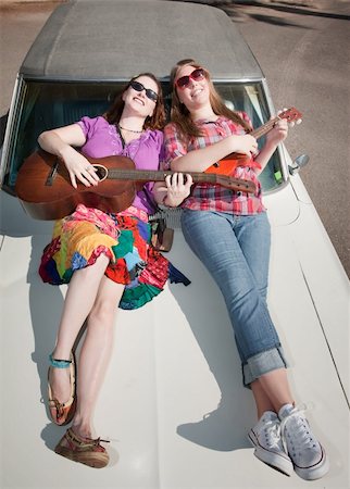 Female Musicians on an Old Car Stock Photo - Budget Royalty-Free & Subscription, Code: 400-05169567