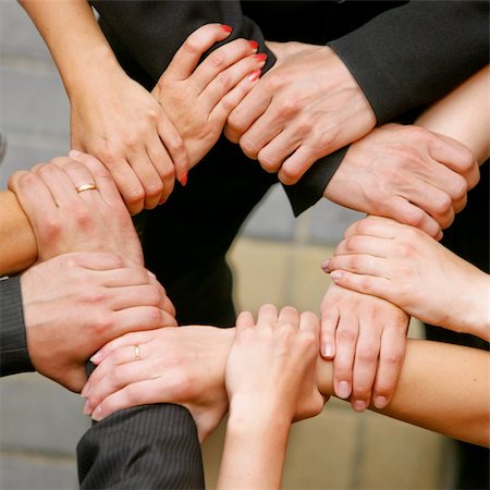 simsearch:700-00046258,k - Close up of people that hold hands together Stock Photo - Budget Royalty-Free & Subscription, Code: 400-05160478