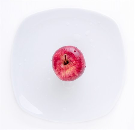 simsearch:400-05674030,k - Red Apple in the white plate on the white background Stock Photo - Budget Royalty-Free & Subscription, Code: 400-05161408