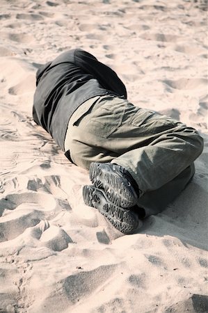 drifter - homeless man sleeping on sand, selective focus on nearest part of man Stock Photo - Budget Royalty-Free & Subscription, Code: 400-05161787