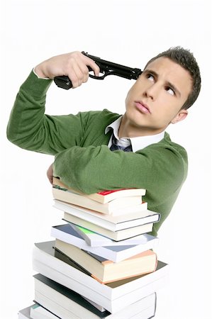 simsearch:400-04704759,k - Unhappy sad student suicide gun metaphor, stacked books over white Stock Photo - Budget Royalty-Free & Subscription, Code: 400-05162660