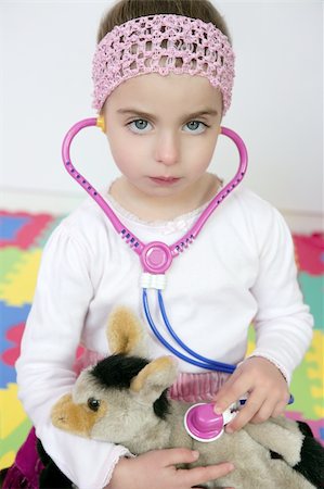 Beautiful preschooler girl pretending to be an animal doctor, stethoscope Stock Photo - Budget Royalty-Free & Subscription, Code: 400-05163138