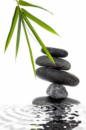 spanishalex (artist) - Stack of lave pebbles with bamboo leaves and a water reflection Stock Photo - Budget Royalty-Free & Subscription, Code: 400-05175967