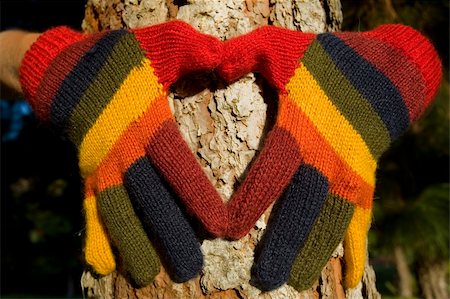 spanishalex (artist) - Womans hands in colorful gloves making a heart shape on a pine tree trunk Stock Photo - Budget Royalty-Free & Subscription, Code: 400-05177818