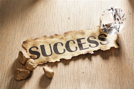 Success concept using burnt paper with word success printed on it, diamond and gold rock around it Stock Photo - Budget Royalty-Free & Subscription, Code: 400-05170342
