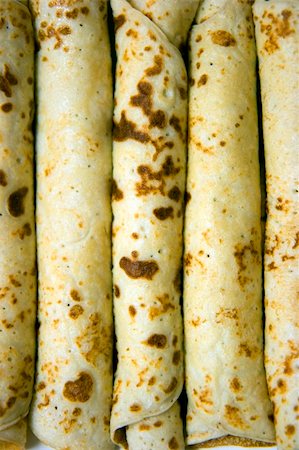 Photo closeup the several pancakes braided in tube Stock Photo - Budget Royalty-Free & Subscription, Code: 400-05170579