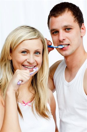 simsearch:400-04151135,k - Couple cleaning their teeth in bathroom Stock Photo - Budget Royalty-Free & Subscription, Code: 400-05171376