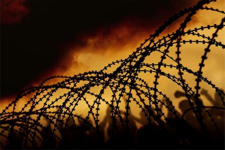 refugee - the barbed wire with clouds and light Stock Photo - Budget Royalty-Free & Subscription, Code: 400-05186697