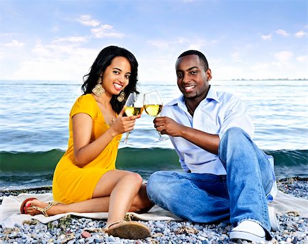 Young romantic couple celebrating with wine at the beach Stock Photo - Budget Royalty-Free & Subscription, Code: 400-05187282