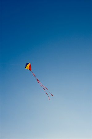 Flying kite in the blue sky Stock Photo - Budget Royalty-Free & Subscription, Code: 400-05187359