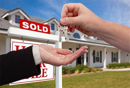 simsearch:700-03508131,k - Handing Over the House Keys in Front of Sold New Home Against a Blue Sky Stock Photo - Budget Royalty-Free & Subscription, Code: 400-05188893