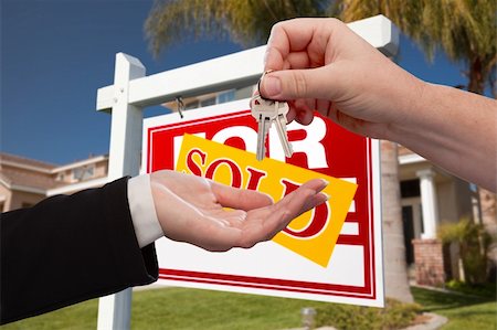 simsearch:700-03508131,k - Agent Handing Over the Key to a New Home with Real Estate Sign and House in the Background. Stock Photo - Budget Royalty-Free & Subscription, Code: 400-05181178