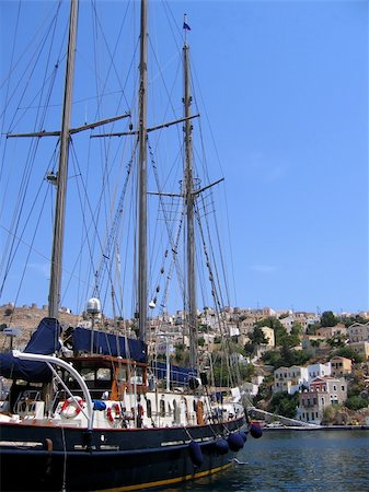 simsearch:400-04793526,k - Sailing vessel in the harbor of the Greek city. Symi Island Stock Photo - Budget Royalty-Free & Subscription, Code: 400-05181186