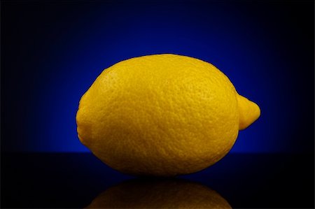 simsearch:400-06513460,k - Fresh lemon isolated on dark background with blue gradient Stock Photo - Budget Royalty-Free & Subscription, Code: 400-05181666
