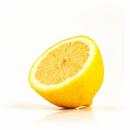 simsearch:400-06513460,k - Fresh half of lemon isolated on white background facing left Stock Photo - Budget Royalty-Free & Subscription, Code: 400-05181669