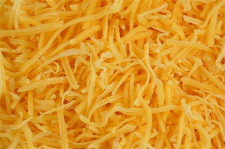 A Shredded cheddar cheese background Stock Photo - Budget Royalty-Free & Subscription, Code: 400-05195013