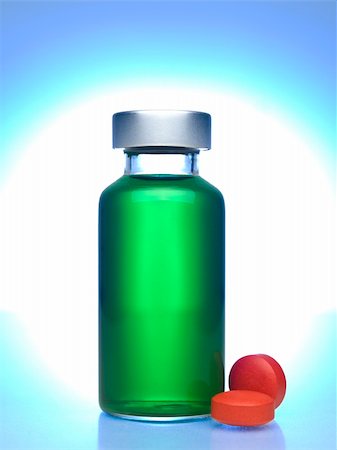 simsearch:400-05713485,k - Close up of a vial full of green liquid, red pills aside. Stock Photo - Budget Royalty-Free & Subscription, Code: 400-05196081