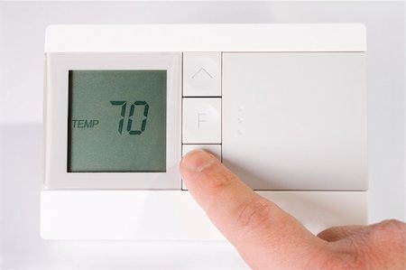 Stock image of hand adjusting thermostat Stock Photo - Budget Royalty-Free & Subscription, Code: 400-05198833
