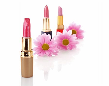 simsearch:400-05708035,k - New lipstick on cosmetics and flower  background Stock Photo - Budget Royalty-Free & Subscription, Code: 400-05199791