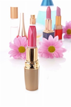 simsearch:400-05708035,k - New lipstick on cosmetics and flower  background Stock Photo - Budget Royalty-Free & Subscription, Code: 400-05199793