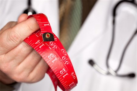 fat man exercising - Doctor with Stethoscope Holding Red Measuring Tape. Stock Photo - Budget Royalty-Free & Subscription, Code: 400-05192350