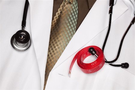 fat man exercising - Doctor with Stethoscope and Red Measuring Tape. Stock Photo - Budget Royalty-Free & Subscription, Code: 400-05192369