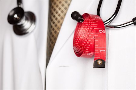 fat man exercising - Doctor with Stethoscope and Red Measuring Tape. Stock Photo - Budget Royalty-Free & Subscription, Code: 400-05192371