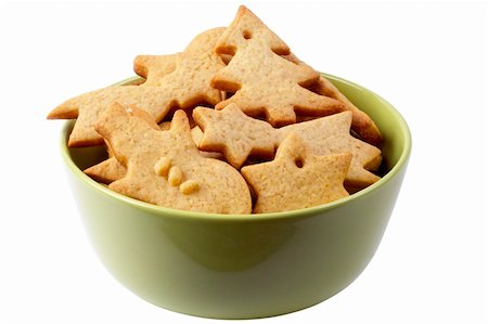 simsearch:400-05721521,k - Christmas ginger butter cookies in the olive bowl macro shot isolated over white background Stock Photo - Budget Royalty-Free & Subscription, Code: 400-05193080