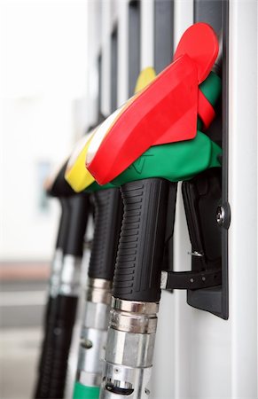 Several gasoline pump nozzles at petrol station Stock Photo - Budget Royalty-Free & Subscription, Code: 400-05193303